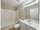 Bathroom featuring sink, toilet, bathtub and shower combination offers functionality and comfort at 829 N Lake Ave, Lakeland, FL 33801
