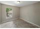 A bright bedroom with natural light streaming through the window, awaiting your personal touch at 829 N Lake Ave, Lakeland, FL 33801