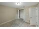 This is a bedroom with an open closet with white wire shelving at 829 N Lake Ave, Lakeland, FL 33801