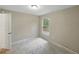 This bedroom features natural lighting from the window, inviting comfort and relaxation at 829 N Lake Ave, Lakeland, FL 33801