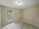 Sunlit bedroom with a large window provides space to unwind and personalize at 829 N Lake Ave, Lakeland, FL 33801
