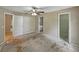 An expansive bedroom showcases a ceiling fan, closet access, and an ensuite bath entrance at 829 N Lake Ave, Lakeland, FL 33801