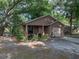 Charming single-Gathering home with a cozy front porch, complemented by mature landscaping and a single-car garage at 829 N Lake Ave, Lakeland, FL 33801