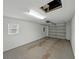 Large two-car garage with mechanical door, window and a clean white interior at 829 N Lake Ave, Lakeland, FL 33801