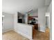 View of a kitchen with dark wood cabinets and a breakfast bar open to the living space at 829 N Lake Ave, Lakeland, FL 33801