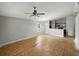 Open living room showcases a ceiling fan and view into the kitchen area at 829 N Lake Ave, Lakeland, FL 33801