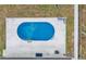 An aerial view of the sparkling kidney-shaped pool in the backyard provides a private and relaxing retreat at 934 Point View Ln, Lakeland, FL 33813