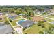 Landscaped backyard featuring a private pool and surrounded by a white fence in a serene residential neighborhood at 934 Point View Ln, Lakeland, FL 33813