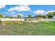 Enjoy a spacious backyard with a sparkling pool, a fire pit, and a pristine white fence for privacy at 934 Point View Ln, Lakeland, FL 33813