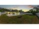 A backyard with a pool, fire pit, and patio offers a perfect outdoor retreat and space for relaxation and fun at 934 Point View Ln, Lakeland, FL 33813