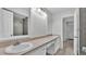Well-lit bathroom featuring double sinks with ample counter space and tiled floors at 934 Point View Ln, Lakeland, FL 33813