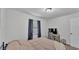 A simple bedroom with a bed, a desk with a chair, and curtains at 934 Point View Ln, Lakeland, FL 33813