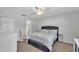 Bright bedroom featuring a ceiling fan, neutral walls, and a comfortable bed at 934 Point View Ln, Lakeland, FL 33813