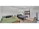 Spacious bedroom with two beds and view into kitchen area at 934 Point View Ln, Lakeland, FL 33813