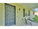 Inviting front porch area with seating, house number 934, and decorative front door at 934 Point View Ln, Lakeland, FL 33813