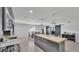 Bright kitchen featuring a large island, dining area, and stylish pendant lighting at 934 Point View Ln, Lakeland, FL 33813
