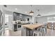 Modern kitchen with stainless steel appliances, a spacious island, and a stylish dining area at 934 Point View Ln, Lakeland, FL 33813