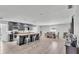 Modern kitchen with stainless steel appliances, a spacious island, and a stylish dining area at 934 Point View Ln, Lakeland, FL 33813