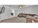 Inviting living room featuring plush carpeting, a comfortable couch, and natural light at 934 Point View Ln, Lakeland, FL 33813