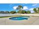 A kidney-shaped pool offers a refreshing retreat in a private, fenced backyard with lush grass at 934 Point View Ln, Lakeland, FL 33813