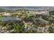 Gorgeous aerial view of a home nestled in a lush, green neighborhood with a view of the nearby lake at 941 Avon Ave, Lakeland, FL 33801