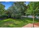 Well maintained backyard with lush green grass and mature landscaping at 941 Avon Ave, Lakeland, FL 33801