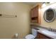 Updated bathroom featuring granite countertops, and a wooden vanity cabinet at 941 Avon Ave, Lakeland, FL 33801