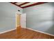 Bedroom featuring hardwood floors, a neutral paint color, with easy access to other rooms in the house at 941 Avon Ave, Lakeland, FL 33801