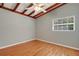 Well lit bedroom with hardwood floors, ceiling fan and window at 941 Avon Ave, Lakeland, FL 33801