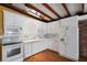 Functional kitchen featuring white cabinets, ample counter space, and modern appliances at 941 Avon Ave, Lakeland, FL 33801