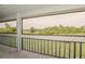 Bright balcony offering verdant views at 102 Canterbury Dr, Haines City, FL 33844