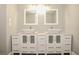 Bathroom with dual vessel sinks and cabinet storage at 102 Canterbury Dr, Haines City, FL 33844