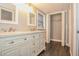 Bathroom with double sinks, a decorative vanity, and a closet at 102 Canterbury Dr, Haines City, FL 33844