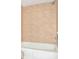Bathroom features a bathtub with ceramic tile surround and shower head at 102 Canterbury Dr, Haines City, FL 33844