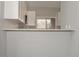 Kitchen area featuring a bar with sink and white cabinets at 102 Canterbury Dr, Haines City, FL 33844