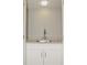 Wet bar with granite countertop and white cabinets at 102 Canterbury Dr, Haines City, FL 33844