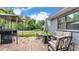 Paver patio featuring outdoor sofa, chairs, BBQ grill, and gazebo, perfect for entertaining at 1020 E Palmetto St, Lakeland, FL 33801