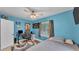 Cozy bedroom with ceiling fan, desk, and great natural light at 1020 E Palmetto St, Lakeland, FL 33801