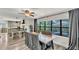 Dining room with backyard view, connected to kitchen with island seating and stainless hood at 1020 E Palmetto St, Lakeland, FL 33801