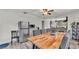 Open concept dining and kitchen with wood table, gray chairs, and stainless steel refrigerator at 1020 E Palmetto St, Lakeland, FL 33801