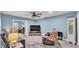 Cozy living room featuring stylish furniture, a ceiling fan, and a modern entertainment center at 1020 E Palmetto St, Lakeland, FL 33801