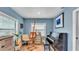 Cozy living room featuring an easel, a piano, and calming blue walls at 1020 E Palmetto St, Lakeland, FL 33801