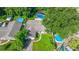 Aerial view of home with screened pool and a spacious backyard at 111 Beverly Dr, Winter Haven, FL 33884