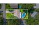 Overhead aerial view of property showcasing a screened-in pool, driveway, and neighborhood at 111 Beverly Dr, Winter Haven, FL 33884