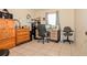 Bedroom with a wooden dresser, a wooden cabinet, a desk and tiled floor at 111 Beverly Dr, Winter Haven, FL 33884