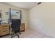 This bedroom features neutral walls, a window with blinds, and an office nook at 111 Beverly Dr, Winter Haven, FL 33884