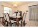 Formal dining room with a chandelier, a table with seating for six, and access to an adjacent room at 111 Beverly Dr, Winter Haven, FL 33884