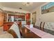 Dining room displaying modern chandelier and a kitchen view with granite counters and stainless appliances at 111 Beverly Dr, Winter Haven, FL 33884
