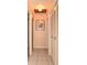 Hallway showing tile flooring, white trim, and closet space at 111 Beverly Dr, Winter Haven, FL 33884