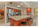Well-equipped kitchen features stainless steel appliances and a spacious granite countertop island with seating at 111 Beverly Dr, Winter Haven, FL 33884